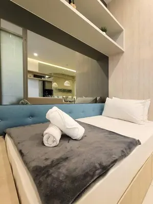 a bedroom with a bed with a towel on it at The Robertson @ 118 Tower Super View in Kuala Lumpur
