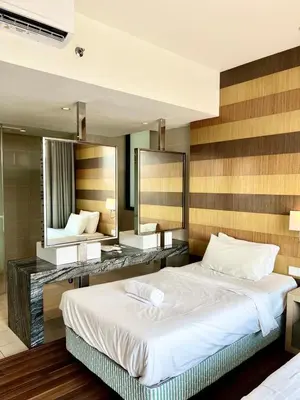 a bedroom with a large bed and a large mirror at D'Majestic by Lush Living in Kuala Lumpur