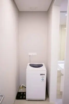 a washing machine in a bathroom with a mirror at Stylish & Cozy TTDI Ascencia Studio FREE Parking in Kuala Lumpur
