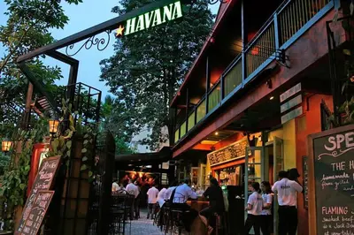a group of people standing outside of a restaurant at Stylish & Cozy TTDI Ascencia Studio FREE Parking in Kuala Lumpur