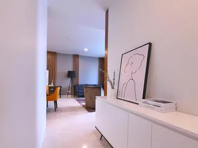 a living room with a mirror and a room at Tropicana The Residences - KLCC VIEW Luxury Apartment Collections in Kuala Lumpur