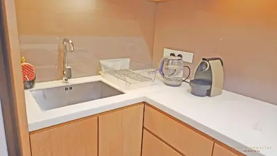 a kitchen counter with a sink and a mixer at Luxurious stay in 188 Fraser Residence Suite in Kuala Lumpur