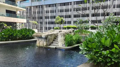 a fountain in the middle of a building at Luxurious stay in 188 Fraser Residence Suite in Kuala Lumpur