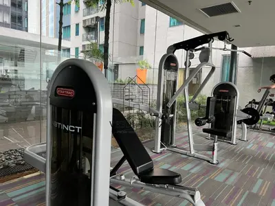 a group of tread machines in a gym at Mercu Summer Suites in Kuala Lumpur