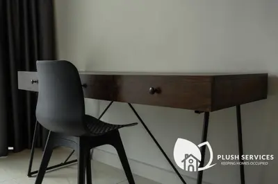 a desk with a chair in front of a desk at Datum Jelatek by Plush in Kuala Lumpur