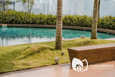 a swimming pool in the middle of a city with buildings at Datum Jelatek by Plush in Kuala Lumpur
