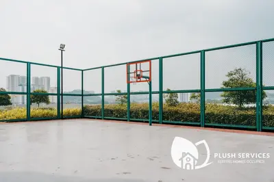 an empty basketball hoop with a view of the city at Datum Jelatek by Plush in Kuala Lumpur