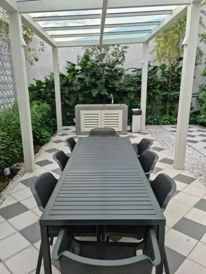 a picnic table and chairs on a patio at Una Residence by Maya in Kuala Lumpur