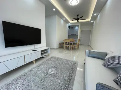 a living room with a television and a couch at Bayu Andaman KL Centre in Kuala Lumpur