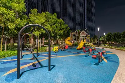 a playground with a bunch of slides and swings at M Vertica Premier Suites Kuala Lumpur in Kuala Lumpur