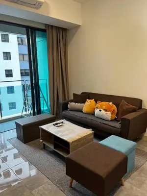a living room with a couch and a coffee table at The Ooak Suite in Kuala Lumpur