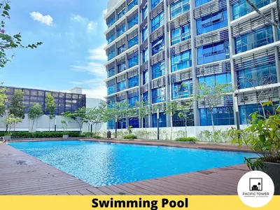 an image of a swimming pool in front of a building at Pacific Homestay Petaling Jaya @ 1 Utama and Universiti Malaya in Petaling Jaya