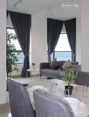 a living room with a table with chairs and a couch at Arte Plus Ampang By Awesomestay in Kuala Lumpur