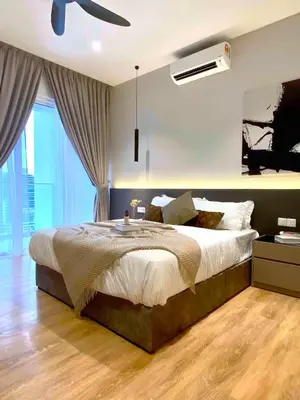 a bedroom with a large bed and a ceiling fan at Quill Residences Kuala Lumpur in Kuala Lumpur