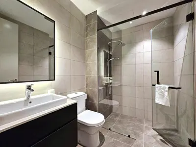 a bathroom with a toilet and a sink and a shower at AXON Residence Kuala Lumpur in Kuala Lumpur