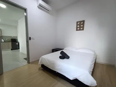 a bedroom with a white bed and a mirror at The Pano Jalan Ipoh Sentul by Kenangan Homes in Kuala Lumpur