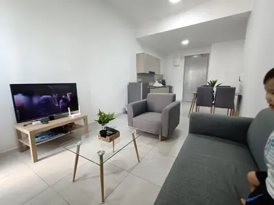 a living room with a couch and a tv at The Pano Jalan Ipoh Sentul by Kenangan Homes in Kuala Lumpur