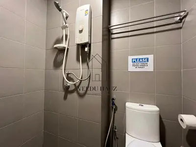a bathroom with a shower and a toilet in it at Mercu Summer Suites KLCC by Veedu Hauz in Kuala Lumpur