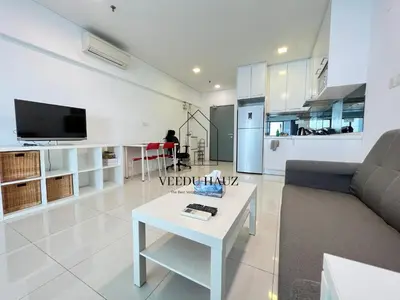 a living room with a couch and a table at Mercu Summer Suites KLCC by Veedu Hauz in Kuala Lumpur
