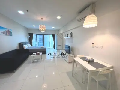 a living room with a couch and a table at Mercu Summer Suites KLCC by Veedu Hauz in Kuala Lumpur