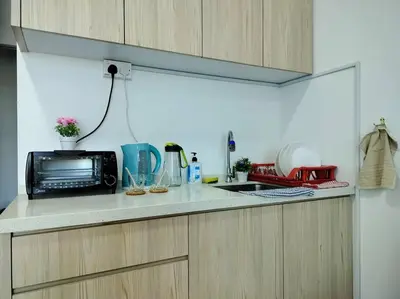 a kitchen counter with a microwave and a sink at Ampang 2-4 pax Studio AmpPoint in Ampang