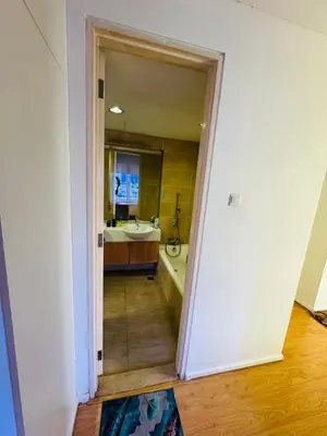a bathroom with a tub and a sink and a mirror at Bintang Goldhill Guest House in Kuala Lumpur