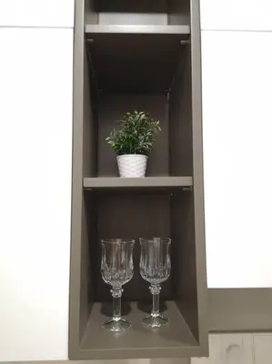 two wine glasses and a potted plant on a shelf at Romantic Log Cabin 2 - Heart of KL, near KLCC/KL Tower in Kuala Lumpur
