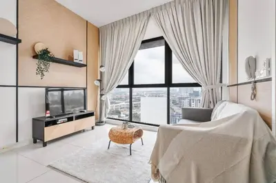 a bedroom with a bed and a large window at Cozy Studio near TRX By Rumabnb in Kuala Lumpur