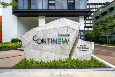 a stone sign in front of a building at Cozy Studio near TRX By Rumabnb in Kuala Lumpur