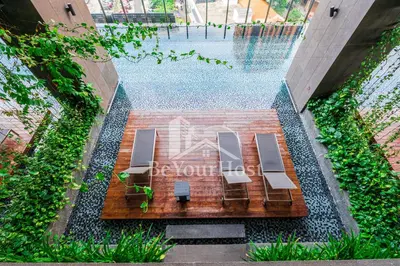 an overhead view of a pool with two benches at Anggun Residences Luxury Suites KL City Center in Kuala Lumpur