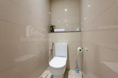 a bathroom with a toilet and a shower at Anggun Residences Luxury Suites KL City Center in Kuala Lumpur