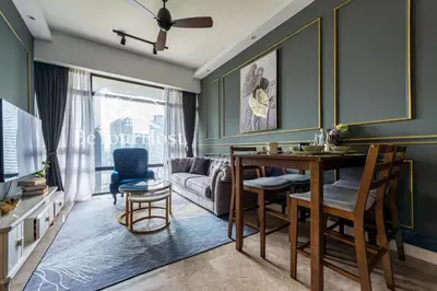 a living room with a table and a couch at Anggun Residences Luxury Suites KL City Center in Kuala Lumpur