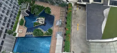 an overhead view of a swimming pool in a city at Cozy Apartment with Jacuzzi and Sauna at 188 Suites Klcc in Kuala Lumpur