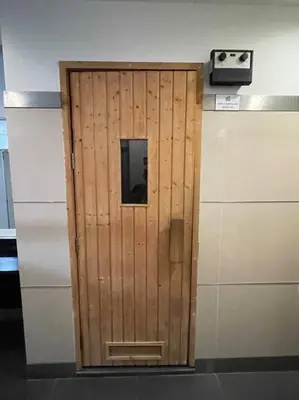 a wooden door in the middle of a kitchen at Binjai 8 Premium Soho, KLCC, nearby LRT by EC in Kuala Lumpur