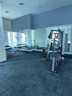 a gym with cardio equipment in a large building at Binjai 8 Premium Soho, KLCC, nearby LRT by EC in Kuala Lumpur