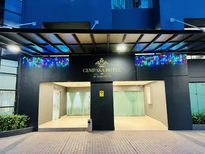 a building with a sign on the front of it at Menara PGRM By Minsu in Kuala Lumpur