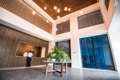 a couple taking a picture in the lobby of a building at KLSentral-Bangsar-MidValley-2-10pax-Netflix-Balcony-Super Fast Internet in Kuala Lumpur