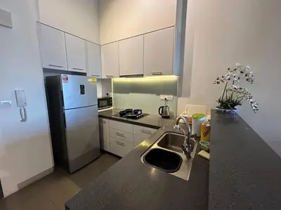 a kitchen with a sink and a refrigerator at KLSentral-Bangsar-MidValley-2-10pax-Netflix-Balcony-Super Fast Internet in Kuala Lumpur